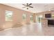 Living room with tile flooring, multiple windows, and an adjacent kitchen area at 2725 E Mine Creek Rd # 1149, Phoenix, AZ 85024