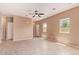 Living room with tiled floors, a ceiling fan, and a white entry door at 2725 E Mine Creek Rd # 1149, Phoenix, AZ 85024