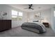 Stylishly furnished bedroom featuring neutral decor, carpet, and a decorative mirror at 2732 N 217Th Ave, Buckeye, AZ 85396