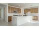 Modern kitchen with ample cabinets, quartz countertops, and a central island at 2732 N 217Th Ave, Buckeye, AZ 85396
