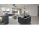 Bright, open-concept living room featuring modern furnishings and neutral tones and access to the outside patio at 2732 N 217Th Ave, Buckeye, AZ 85396