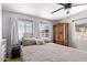 Bedroom featuring an antique-style cabinet with an inviting ceiling fan for added comfort at 4065 E University Dr # 76, Mesa, AZ 85205