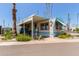 Charming manufactured home with covered parking, small front porch and desert landscaping at 4065 E University Dr # 76, Mesa, AZ 85205