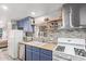 Well-equipped kitchen with stainless steel appliances and gray backsplash at 4065 E University Dr # 76, Mesa, AZ 85205