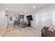 Open living space with a TV, dining table, couch, and wood-look floors for easy maintenance at 4065 E University Dr # 76, Mesa, AZ 85205