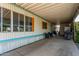 Relaxing covered patio area with ample space for outdoor seating and entertaining guests at 4065 E University Dr # 76, Mesa, AZ 85205