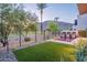 Backyard with artificial grass, desert landscaping, and a pool at 4544 N Evans Dr, Scottsdale, AZ 85251