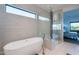 Spa bathroom with a soaking tub and glass shower with a view of the bedroom at 4544 N Evans Dr, Scottsdale, AZ 85251