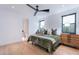Bright bedroom with neutral colors, plush bedding, stylish rug, and plenty of natural light and a view at 4544 N Evans Dr, Scottsdale, AZ 85251