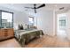 Bright bedroom featuring neutral colors, plush bedding, stylish rug, and plenty of natural light and a view at 4544 N Evans Dr, Scottsdale, AZ 85251