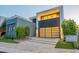 Modern home at dusk featuring a garage with translucent doors and clean landscaping at 4544 N Evans Dr, Scottsdale, AZ 85251