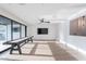 Large and bright game room features a shuffleboard table, hardwood floors and big windows at 4544 N Evans Dr, Scottsdale, AZ 85251