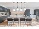 Modern kitchen featuring a large island with counter seating and integrated appliances at 4544 N Evans Dr, Scottsdale, AZ 85251