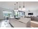 Bright kitchen with an island sink, open floor plan, and large windows with views at 4544 N Evans Dr, Scottsdale, AZ 85251