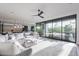 Open-concept living space with a large sectional and expansive windows offering stunning outdoor views at 4544 N Evans Dr, Scottsdale, AZ 85251