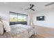 Spacious bedroom with a ceiling fan, large windows and an exterior balcony at 4544 N Evans Dr, Scottsdale, AZ 85251