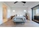 Bright main bedroom boasts hardwood floors and a large glass sliding door to a private balcony at 4544 N Evans Dr, Scottsdale, AZ 85251