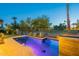 Lush backyard with a pool and desert landscaping at dusk at 4544 N Evans Dr, Scottsdale, AZ 85251