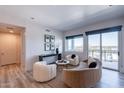 Bright living room showcasing modern furnishings, a balcony with city views, and natural light at 3131 N Central Ave # 6011, Phoenix, AZ 85012