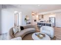 Cozy living area open to a modern kitchen, featuring a comfortable sofa and stylish decor at 3131 N Central Ave # 6011, Phoenix, AZ 85012