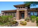 Charming single-Gathering home featuring a gated front entrance and professionally landscaped yard at 12797 S 179Th Dr, Goodyear, AZ 85338