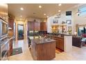 Gourmet kitchen with island, stainless steel appliances, and granite counters at 14021 E Milton Ct, Scottsdale, AZ 85262