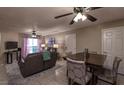 The home features an open-concept living and dining space with tile floors and modern furnishings at 2228 N 52Nd St # 227, Phoenix, AZ 85008