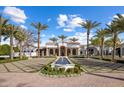 Stunning exterior view of a home with a beautiful fountain and well-manicured landscape and palm trees at 7533 N 70Th St, Paradise Valley, AZ 85253