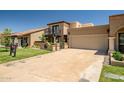 Charming two-story home with a tile roof, balcony, landscaped yard, and a spacious two-car garage at 8094 E Via Del Vencino --, Scottsdale, AZ 85258