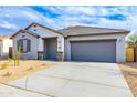 Charming single-story home featuring a two car garage and low maintenance desert landscaping at 17463 N 66Th Ave, Glendale, AZ 85308