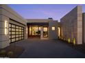 Stylish home featuring a glass garage door and stone accents at 28101 N 109Th Way, Scottsdale, AZ 85262