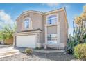 Two-story home featuring a two-car garage, desert landscaping and tile roof at 9143 W Harmony Ln, Peoria, AZ 85382