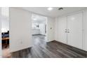 Bright entryway with hardwood floors, closet, and an open view into the connected dining and kitchen areas at 1296 Leisure World --, Mesa, AZ 85206