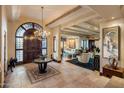Grand entryway with a statement chandelier and views to the living room at 26761 N 98Th Way, Scottsdale, AZ 85262