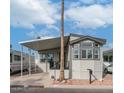 Nice manufactured home with carport and landscaping at 724 Emerald Dr, Apache Junction, AZ 85119