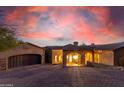 Stunning curb appeal with a three-car garage and arched entryway at 9025 N Flying Butte --, Fountain Hills, AZ 85268