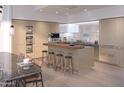 Modern kitchen with a central island, wine storage, and stainless steel appliances at 4849 N Camelback Ridge Rd # A409, Scottsdale, AZ 85251
