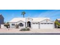 Charming home with a well-manicured front yard and a three car garage, providing curb appeal and practicality at 1660 N 59Th St, Mesa, AZ 85205