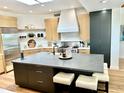 Modern kitchen featuring a large island, stainless steel appliances, and custom cabinetry at 24724 N 119Th Pl, Scottsdale, AZ 85255