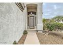 Front entrance with stucco and rock landscaping at 4803 E Barwick Dr, Cave Creek, AZ 85331