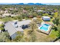 Aerial view of a ranch-style home with pool and detached garage, set on a large lot at 6045 E Duane Ln, Cave Creek, AZ 85331