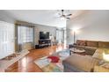 Spacious living room featuring hardwood floors and a comfortable sectional sofa at 6145 E Sierra Morena St, Mesa, AZ 85215