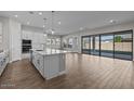 Open-concept kitchen featuring an island, stainless appliances, and access to the living and dining areas at 12312 W Luxton Ln, Avondale, AZ 85323