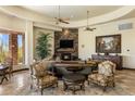 Open-concept living area with fireplace, elegant furnishings and recessed lighting at 10537 N Crestview Dr, Fountain Hills, AZ 85268