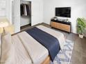 Cozy bedroom with modern furnishings, closet access, and natural light at 16186 W Silver Falls Dr, Surprise, AZ 85374
