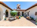 Charming courtyard with seating and potted plants at 31221 N 161St Pl, Scottsdale, AZ 85262