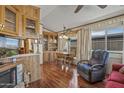 Cozy dining room featuring a wooden table set, built-in cabinets, and ample natural light at 17200 W Bell Rd # 624, Surprise, AZ 85374