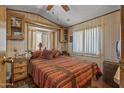 Inviting main bedroom with a queen bed, side tables, and cozy decor at 17200 W Bell Rd # 624, Surprise, AZ 85374