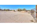 Ranch-style home with desert landscaping and gated entry at 192 S Ralston Rd, Maricopa, AZ 85139