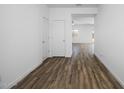 Spacious living area with wood-look floors and bright white walls at 24668 W Alta Vista Rd, Buckeye, AZ 85326